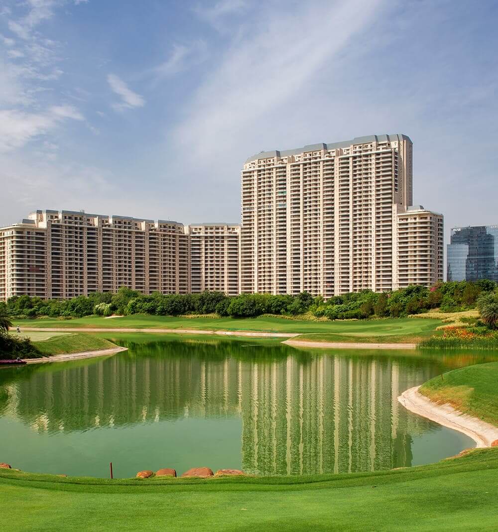 The Camellias towers across the golf-course lake by day