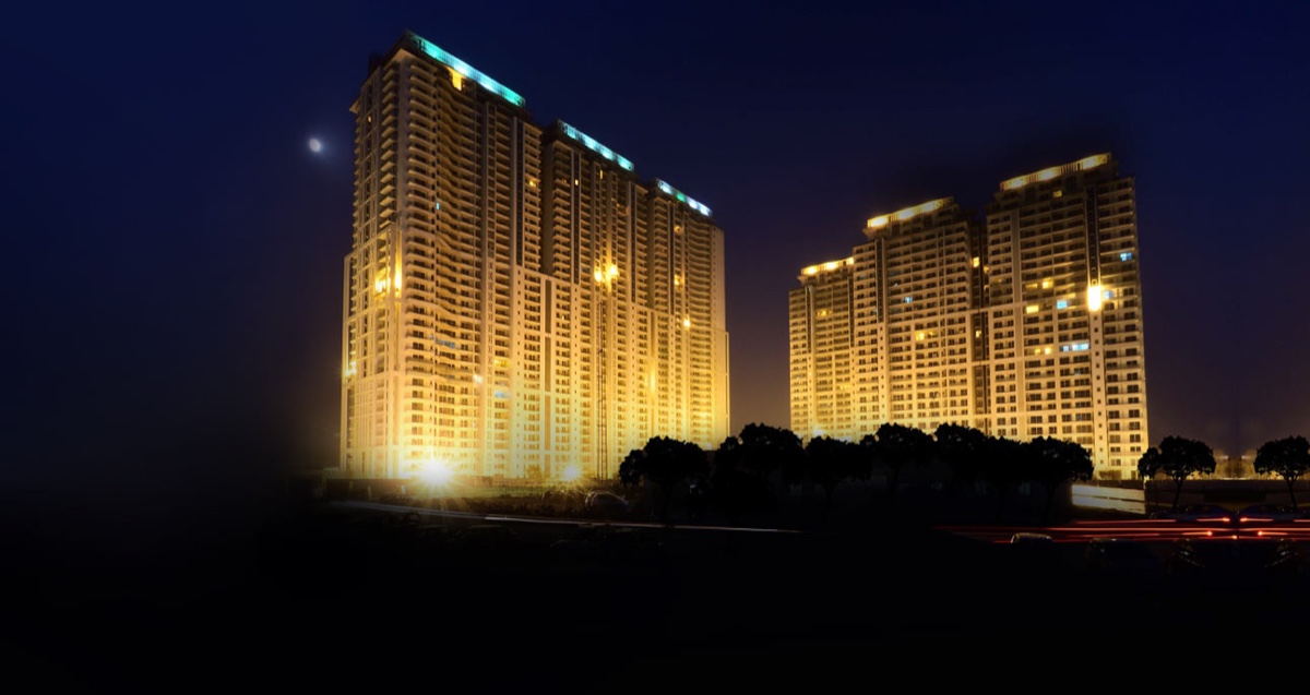 The Crest towers at night from the road (photograph)